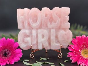 Rose quartz Horse Girl crystal carving on rose gold stand with black background